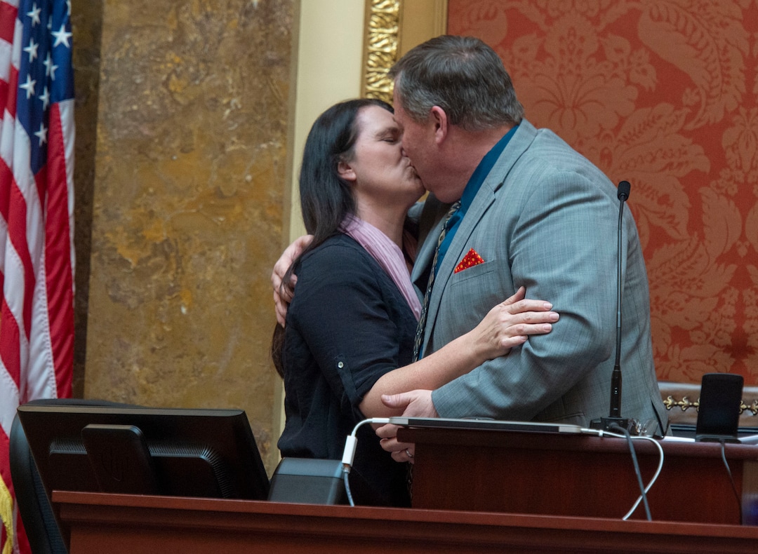 (Rick Egan  |  The Salt Lake Tribune)   Acting speaker Rep. Eric Hutchings breaks House protocol as he interrupts last-day business on the floor to announce that he and his wife Stacey are celebrating their 22nd wedding anniversary today. Thursday, March 14, 2019. After chants from members of the house, he gave her a kiss on the Dais.