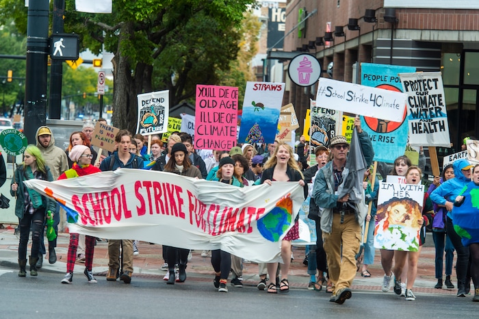 (Rick Egan  |  The Salt Lake Tribune)      Hundreds of students from around the state chant and sing as they march up State Street to the Utah State Capitol Building, demanding action on the climate crisis. Friday, Sept. 20, 2019.