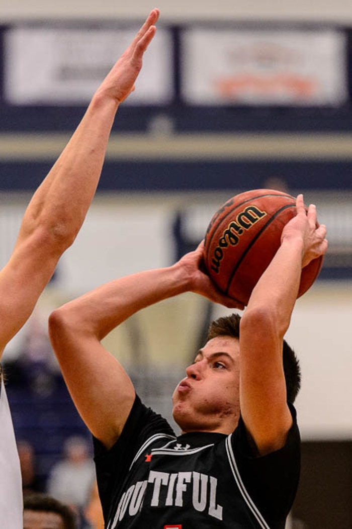(Trent Nelson | The Salt Lake Tribune)  Bountiful's Cooper Ohlson (34) shoots over Corner Canyon's Gabe Toombs (32) as Corner Canyon faces Bountiful in the title game of the Corner Canyon Tournament of Champions, high school boys' basketball in Draper, Saturday December 2, 2017.