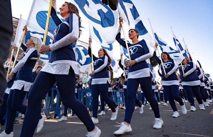 (Francisco Kjolseth | The Salt Lake Tribune) The BYU marching band introduces the football team following close behind before their game against South Florida at LaVell Edwards Stadium in Provo, Saturday, Sept. 25, 2021.