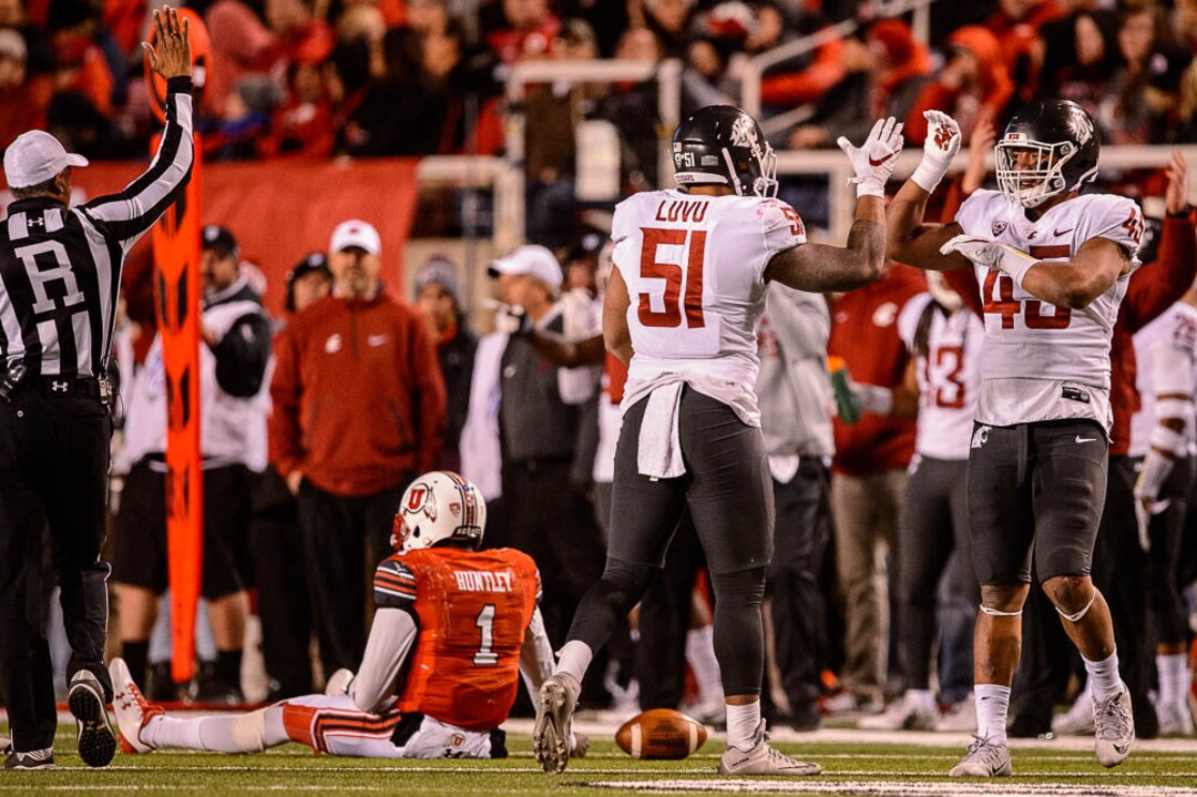 (Trent Nelson | The Salt Lake Tribune)  Washington State Cougars linebacker Frankie Luvu (51) and Washington State Cougars linebacker Logan Tago (45) celebrate a sack of Utah Utes quarterback Tyler Huntley (1) as the University of Utah hosts Washington State, NCAA football in Salt Lake City, Saturday November 11, 2017.