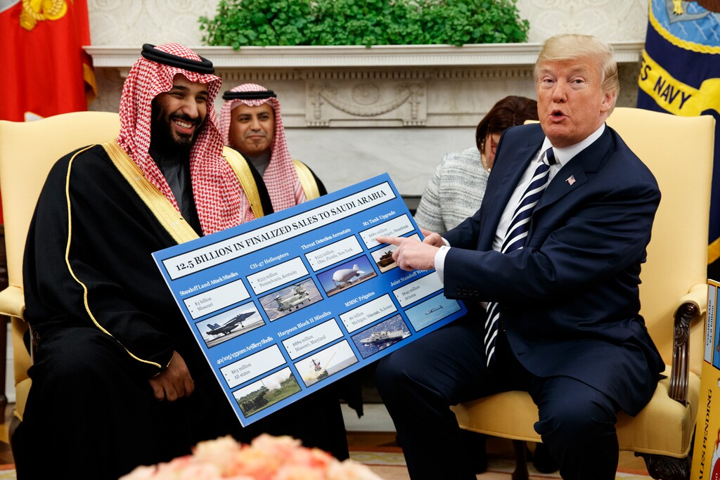 (Evan Vucci | The Associated Press) In this March 20, 2018 file photo, President Donald Trump shows a chart highlighting arms sales to Saudi Arabia during a meeting with Saudi Crown Prince Mohammed bin Salman in the Oval Office of the White House, in Washington. Arab states resoundingly condemned the killing of more than 50 Palestinians on Monday, May 14, 2018 in Gaza protests, just as they have after previous Israeli violence going back decades. But behind the scenes, fears over Iran have divided Arab leaders, with some willing to quietly reach out to Israel.