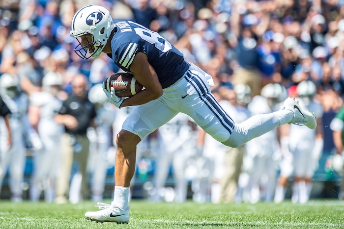 (Chris Detrick  |  The Salt Lake Tribune)  Brigham Young Cougars wide receiver Neil Pau'u (84) runs for a touchdown during the game at LaVell Edwards Stadium Saturday, August 26, 2017.