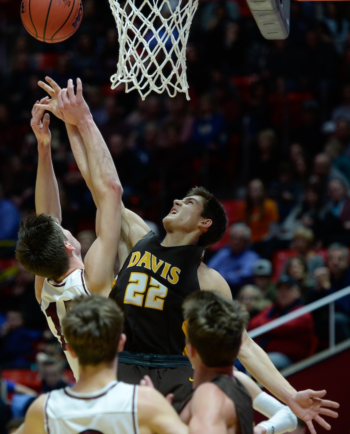 (Francisco Kjolseth  |  The Salt Lake Tribune)  Davis vs Lone Peak, 6A State high school basketball tournament at the Huntsman Center in Salt Lake City, Thursday March 1, 2018. Jaxon Pollard (15) battles Dallin Anderson (22). 