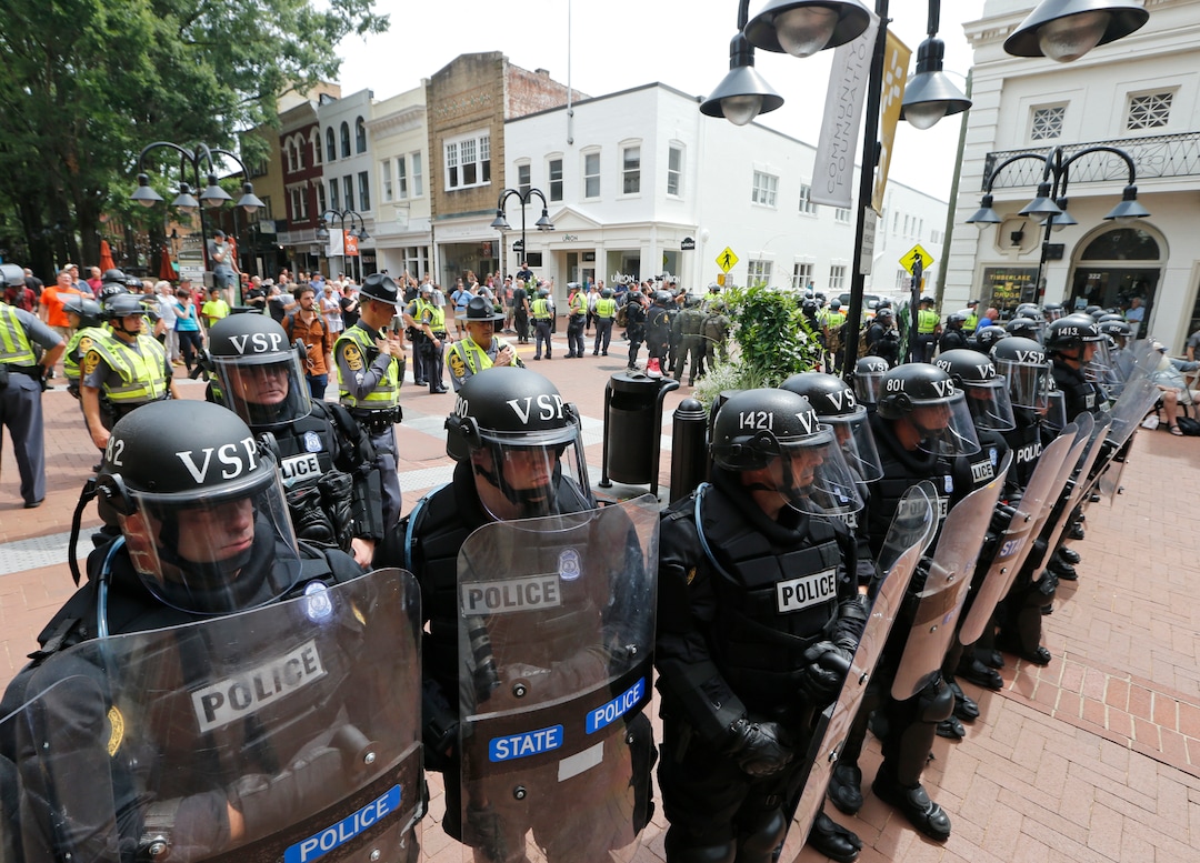 (Steve Helber)  |  AP Photo)  Virginia State Police cordon off an area around the site where a car ran into a group of protesters after a white nationalist rally in Charlottesville, Va., Saturday, Aug. 12, 2017.