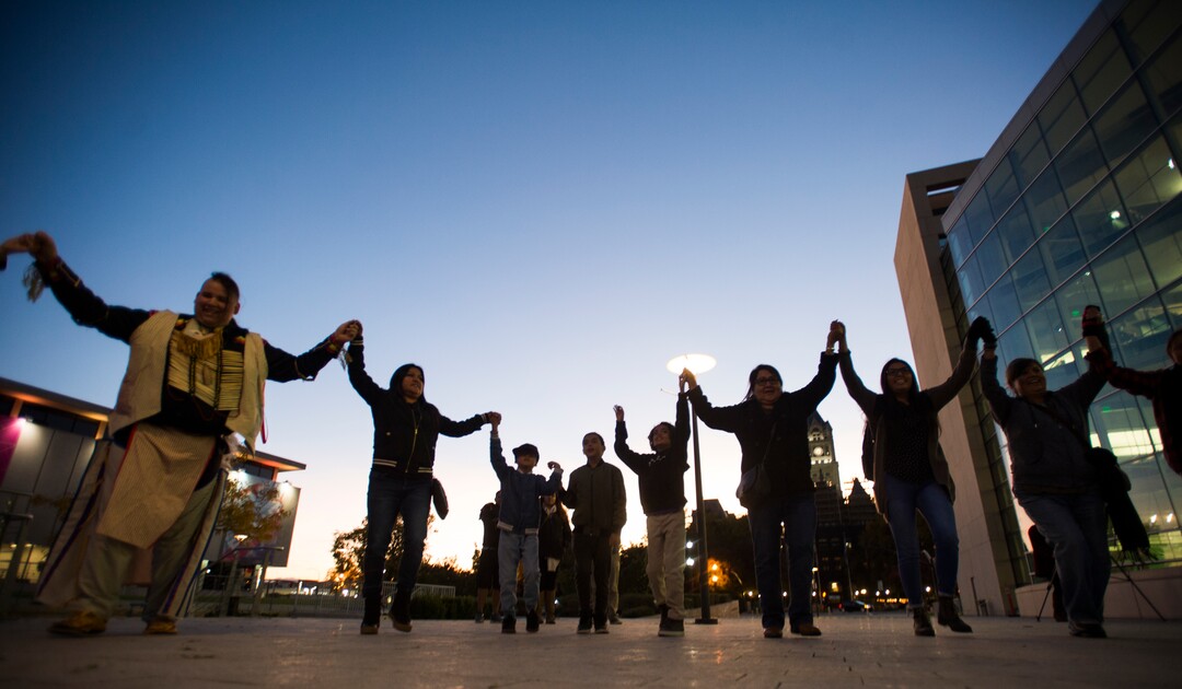 (Rick Egan  |  The Salt Lake Tribune)  Dancers and guests join for a round dance during an Indigenous Peoples Day celebration, hosted by the Utah League of Native American Voters and PANDOS (Peaceful Advocates for Native Dialogue and Organizing Support) at the Salt Lake City Library, Monday, October 9, 2017.