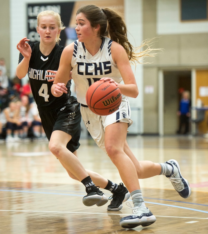 (Rick Egan | The Salt Lake Tribune) Corner Canyon Chargers Kemery Martin (15) gets past Highand High Rams Olivia Beckstead (4), in Class 5A women's basketball playoff game between Corner Canyon and Highland, Monday, Feb. 19, 2018.