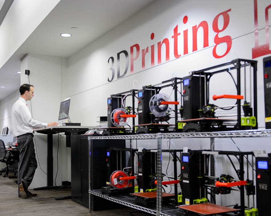 (Trent Nelson | The Salt Lake Tribune) TJ Ferrill, head of creative spaces, works at a 3D printing station in the University of Utah's J. Willard Marriott Library in Salt Lake City on Friday Aug. 3, 2018.