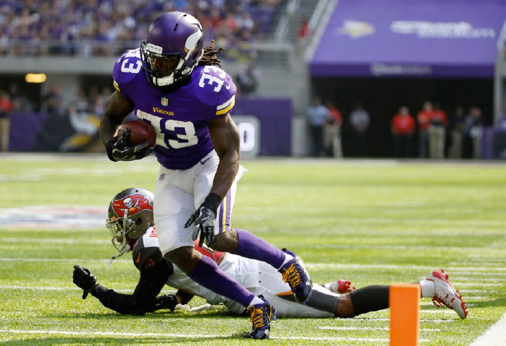 Bruce Kluckhohn | The Associated Press. Minnesota Vikings running back Dalvin Cook (33) runs from Tampa Bay Buccaneers cornerback Vernon Hargreaves, rear, during the first half of an NFL football game, Sunday, Sept. 24, 2017, in Minneapolis.