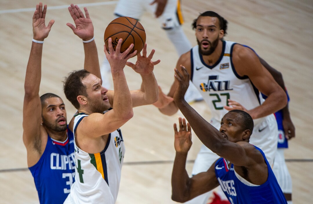(Rick Egan | The Salt Lake Tribune) Utah Jazz forward Bojan Bogdanovic (44) takes the ball inside as LA Clippers forward Serge Ibaka (9) defends, in NBA action between the Utah Jazz and the LA Clippers at Vivint Arena, on Friday, Jan. 1, 2021.
