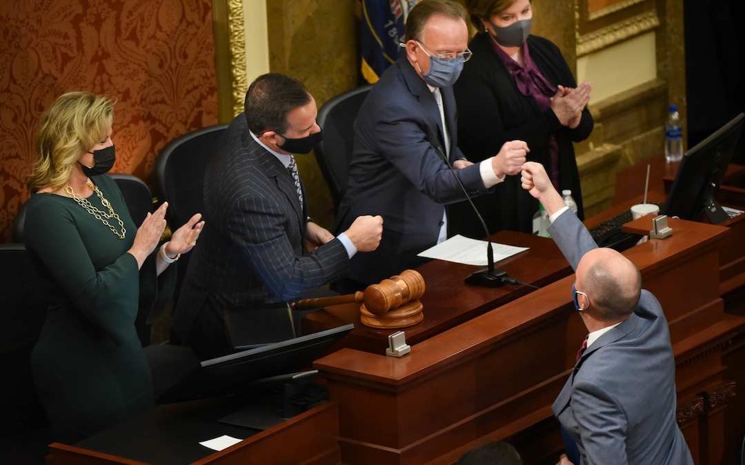 (Francisco Kjolseth  | The Salt Lake Tribune) Gov. Spencer Cox fist bumps Senate President Stuart Adams, R-Layton, and House Speaker Brad Wilson, R-Kaysville, following the governors State of the State address at the Capitol in Salt Lake City on Thursday, Jan. 21, 2021.
