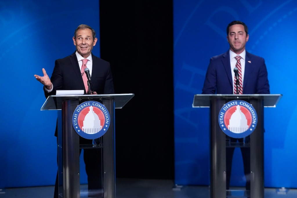 (Rick Bowmer | AP) U.S. Rep. John Curtis, left, reacts to a statement made from Trent Staggs, right, during the Utah Senate primary debate for Republican contenders battling to win the seat of retiring U.S. Sen. Mitt Romney, Monday, June 10, 2024, in Salt Lake City.