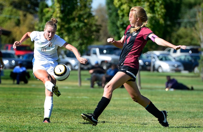 (Scott Sommerdorf  |  Tribune File Photo)  Davis' Olivia Wade lets rip with a shot as Viewmont's Grace Johnson defends during first half play. Davis defeated Viewmont 5-2, Thursday, September 10, 2015.