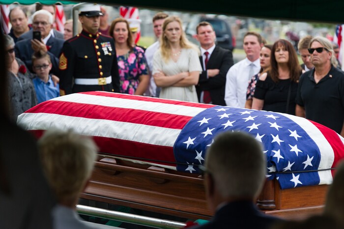 (Alex Gallivan  |  Special to The Tribune) Marine Pfc. Robert K. Holmes, who died 77 years ago aboard the USS Oklahoma during the attack on Pearl Harbor, is laid to rest in the Salt Lake City Cemetery, Monday, Aug. 20, 2018.