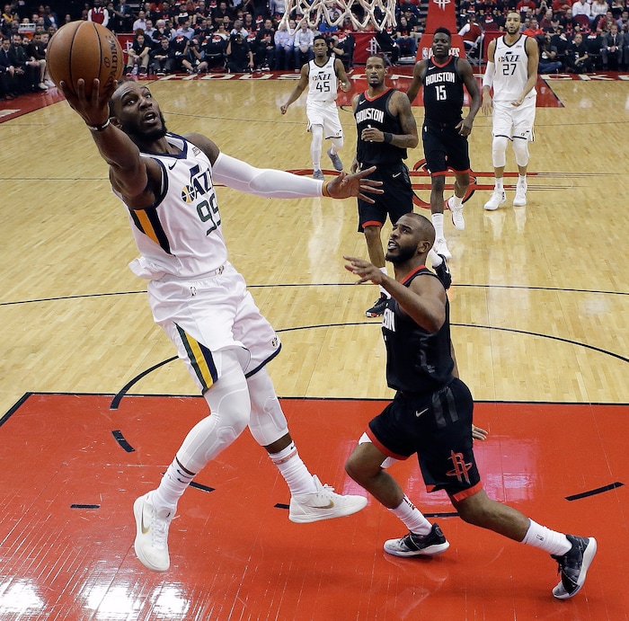 Utah Jazz forward Jae Crowder, left, shoots as Houston Rockets guard Chris Paul, right, watches during the first half in Game 5 of an NBA basketball second-round playoff series, Tuesday, May 8, 2018, in Houston. (AP Photo/Eric Christian Smith)