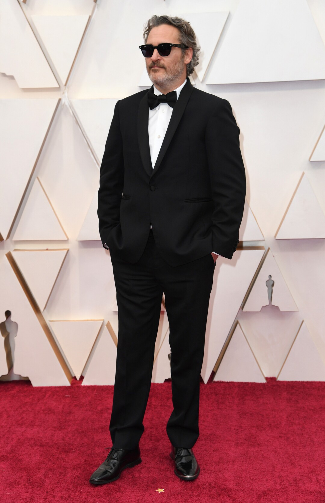 (Richard Shotwell | Invision/AP)  Joaquin Phoenix arrives at the Oscars on Sunday, Feb. 9, 2020, at the Dolby Theatre in Los Angeles.