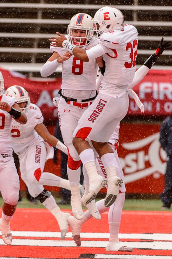 (Trent Nelson | The Salt Lake Tribune)  East's Ben Ford (8) and East's Andre Toilolo (32) celebrate a touchdown as East faces Bingham in the Class 6A High School State Football Championship game in Salt Lake City, Friday November 17, 2017.