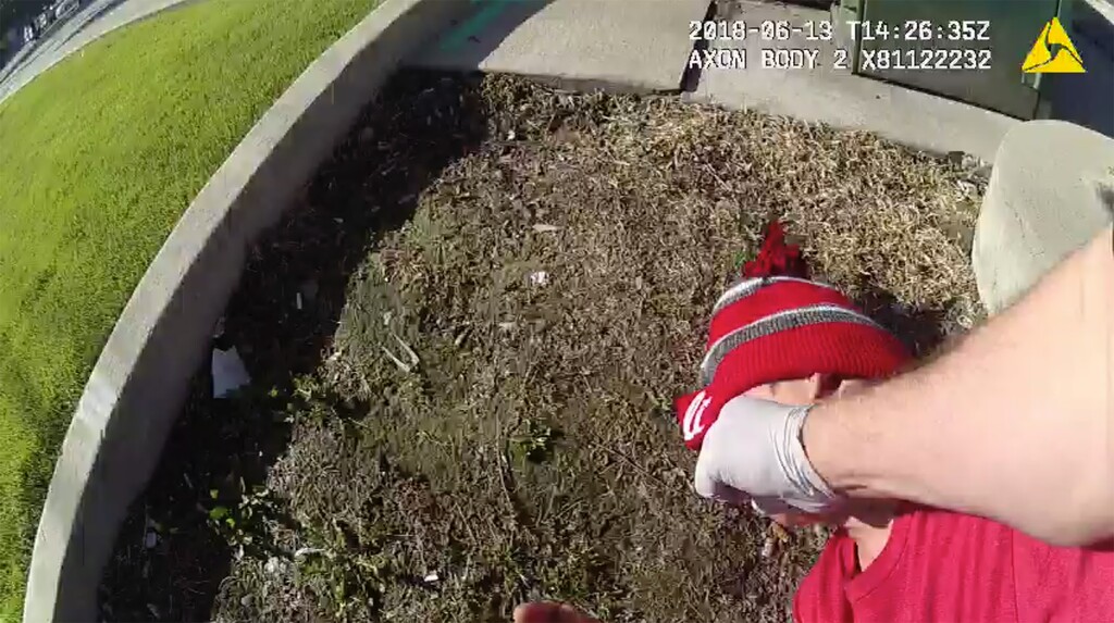 Murray Police Sgt. Luis Argueta was convicted in January of assaulting a 16-year-old boy who was lying in the street unconscious. This screenshot of body camera footage shows the June 13, 2018 incident.