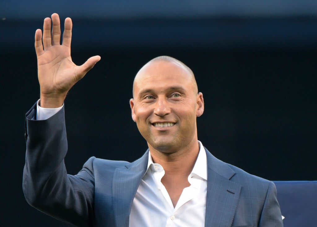 FILE- In this May 24, 2015, file photo, Derek Jeter waves to fans as he is introduced, at the dedication of a plaque for Bernie Williams in Monument Park, before the New York Yankees' baseball game against the Texas Rangers at Yankee Stadium in New York. (AP Photo/Bill Kostroun, File)