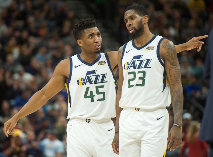 (Rick Egan  |  The Salt Lake Tribune)  Utah Jazz guard Donovan Mitchell (45) talks to Utah Jazz forward Royce O'Neale (23) during a break in the action, in NBA action Utah Jazz vs San Antonio Spurs in Salt Lake City, Monday, February 12, 2018.