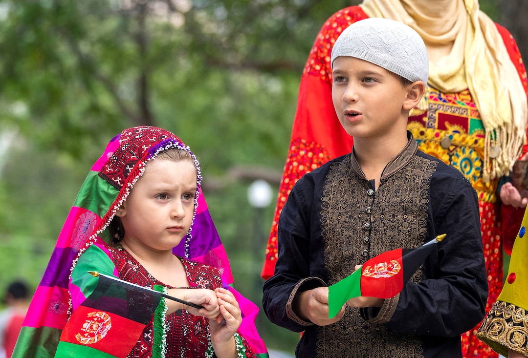 (Rick Egan | The Salt Lake Tribune) Muhammad-Ali Mustafawi and Aiza Mustafawi gather at Murray Park for a prayer vigil in honor of UtahÕs Afghan refugees, onSaturday, Aug. 21, 2021.