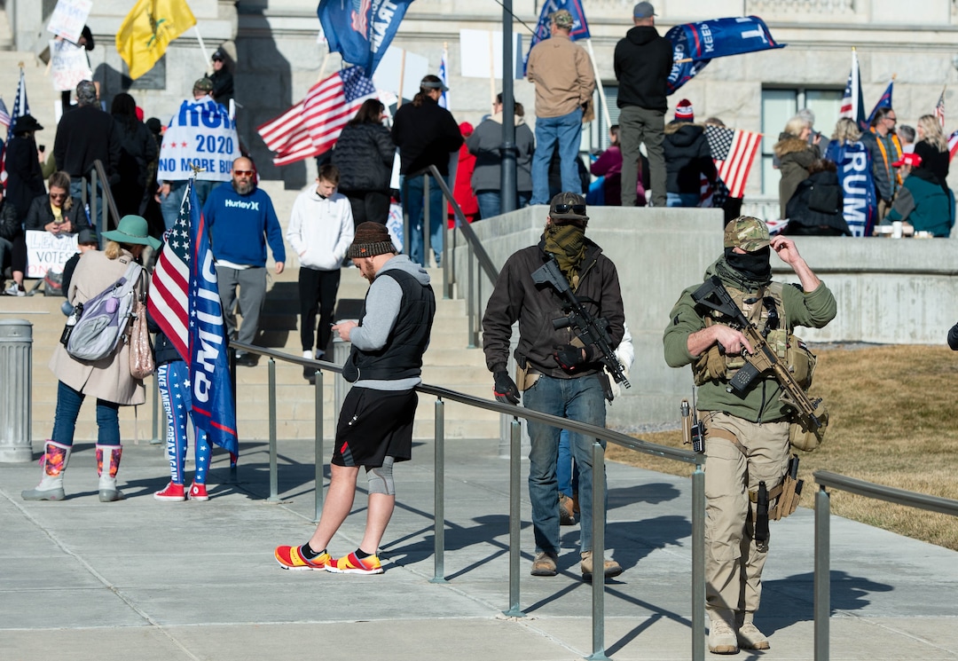 (Francisco Kjolseth  | The Salt Lake Tribune) Heavily armed people walk amongst Trump supporters listening to speeches at the State Capitol in Salt Lake City on Wednesday, Jan. 6, 2021.