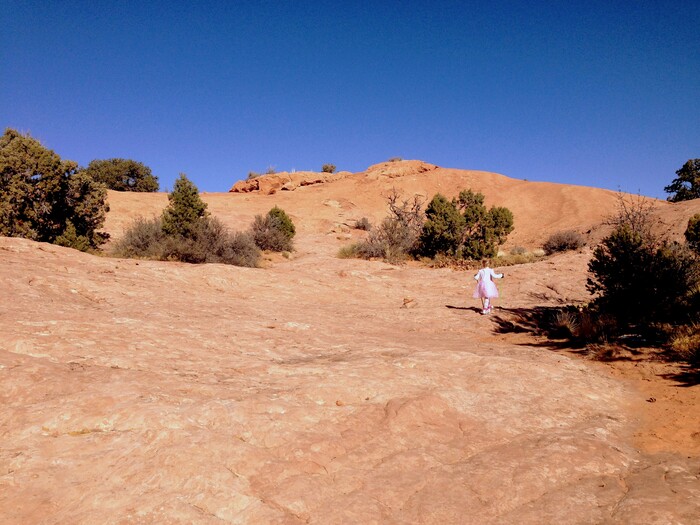 Erin Alberty  |  The Salt Lake TribuneA young hiker ventures toward the slickrock mounds of Whale Rock at Canyonlands National Park.