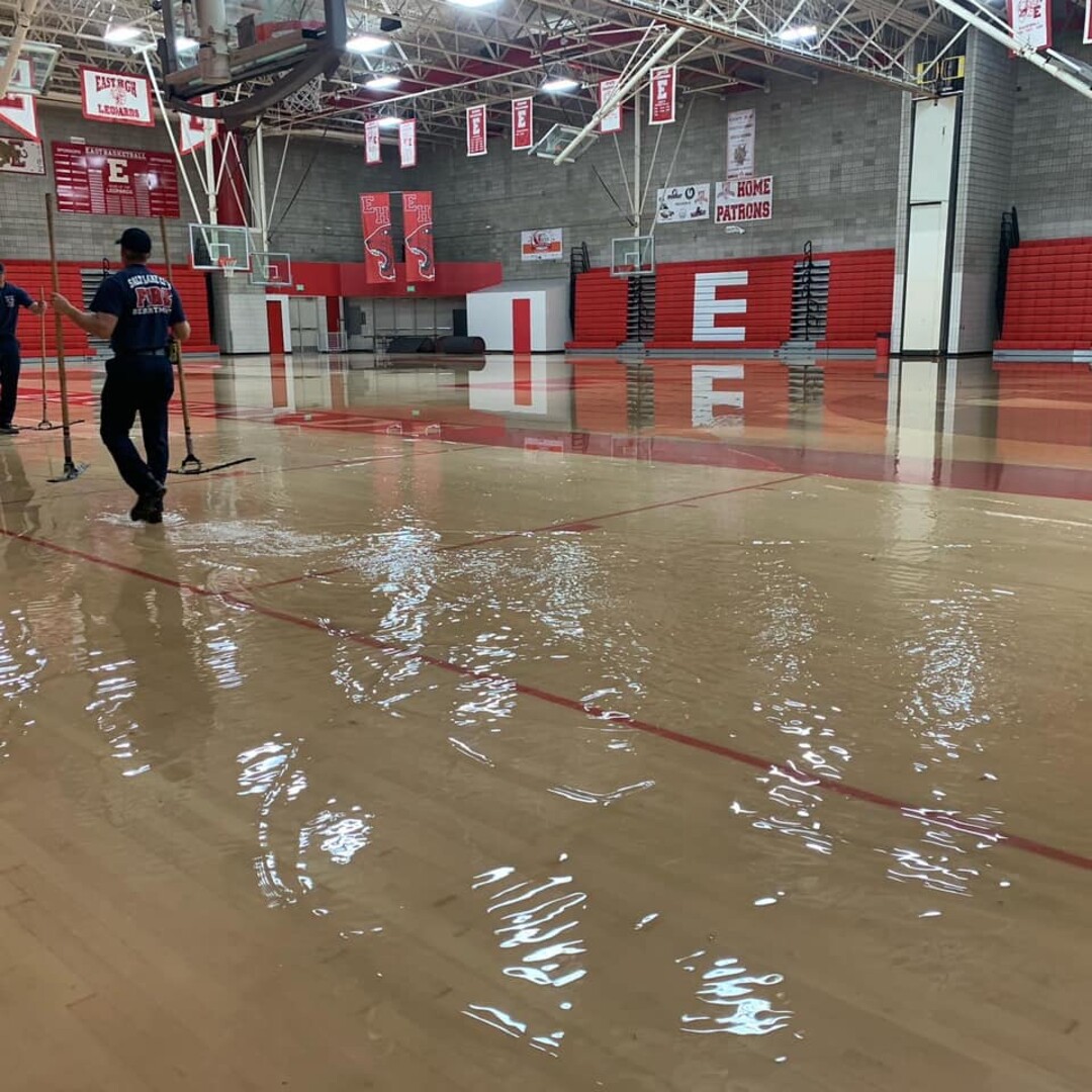 (Salt Lake City School District) The rainstorm that pounded Salt Lake City on Sunday, Aug. 2, 2021, flooded the basketball court at East High.