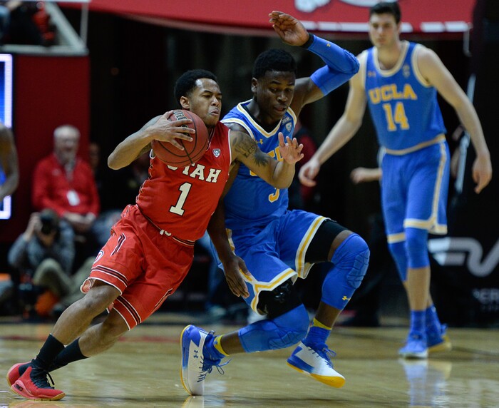 (Francisco Kjolseth  |  The Salt Lake Tribune)  Utah Utes guard Justin Bibbins (1) battles UCLA Bruins guard Aaron Holiday (3) as the University of Utah hosts UCLA in NCAA basketball at the Huntsman Center in Salt Lake City, Thursday, Feb. 22, 2018.