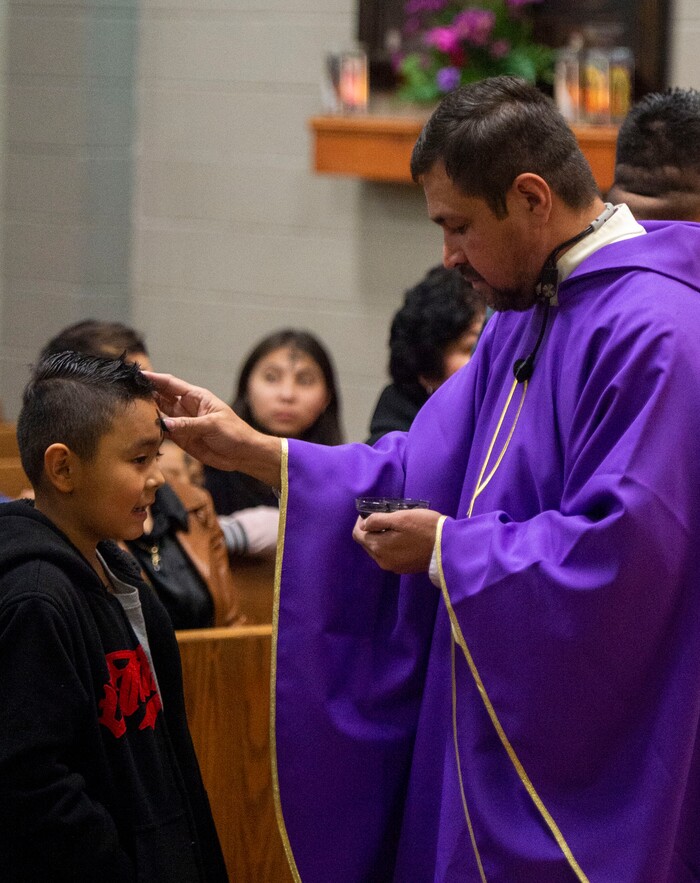 (Rick Egan  |  The Salt Lake Tribune)     Alexander Ortega, 8, receives the ashes from the Rev. Jose Fidel Barrera-Cruz during Ash Wednesday Mass at Our Lady of Guadalupe Catholic Church  in Salt Lake City on Wednesday, March 6, 2019.