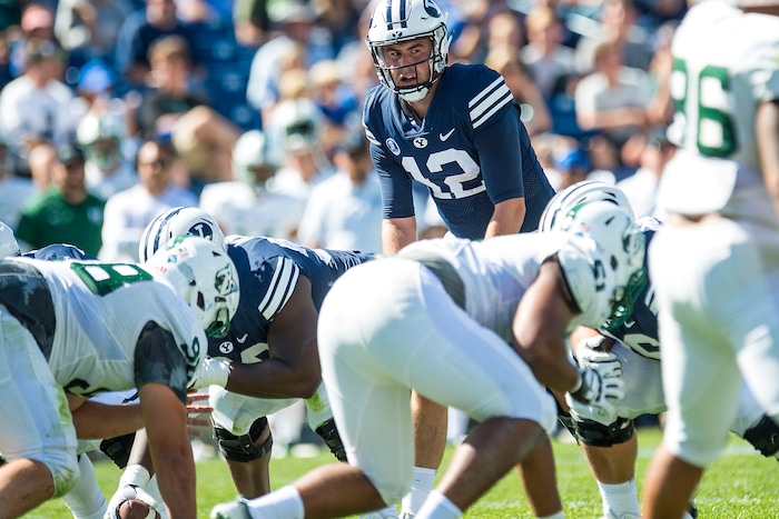 (Chris Detrick  |  The Salt Lake Tribune)  Brigham Young Cougars quarterback Tanner Mangum (12) during the game at LaVell Edwards Stadium Saturday, August 26, 2017.