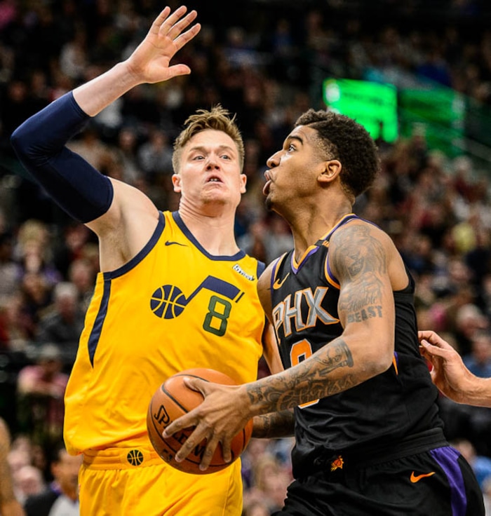 (Trent Nelson | The Salt Lake Tribune)  Utah Jazz forward Jonas Jerebko (8) defending Phoenix Suns forward Marquese Chriss (0) as the Utah Jazz host the Phoenix Suns, NBA basketball in Salt Lake City, Wednesday Feb. 14, 2018.