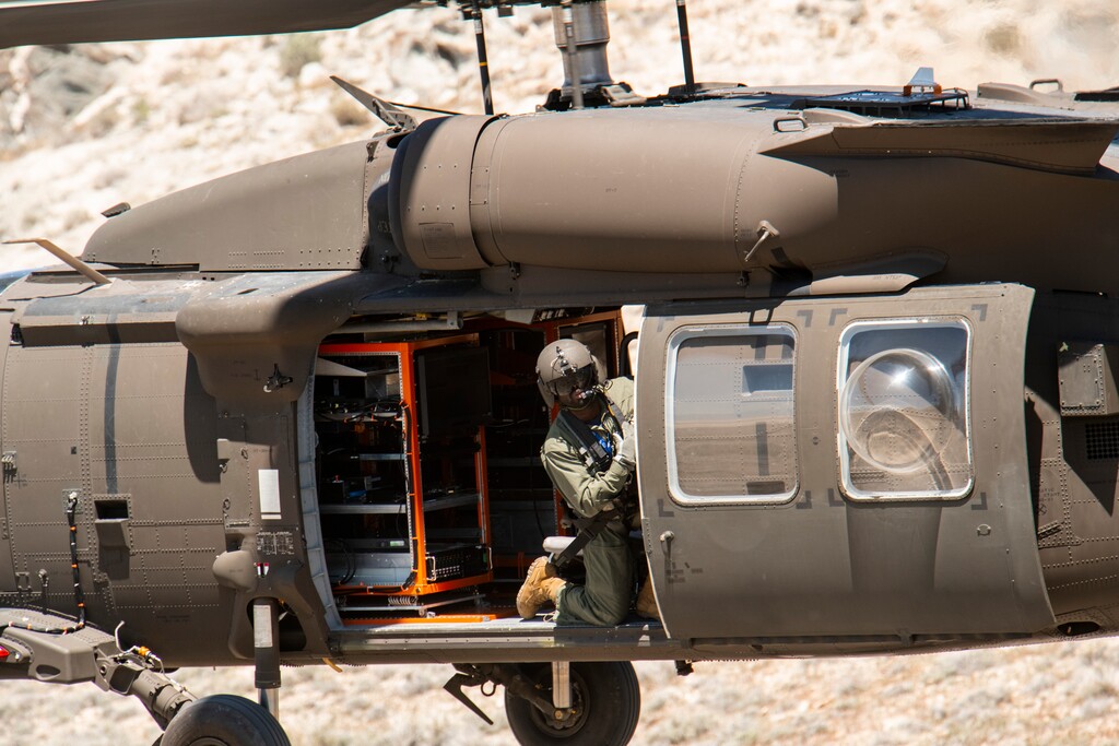 (Dugway Proving Ground) A soldier looks from a helicopter at Dugway Proving Ground.