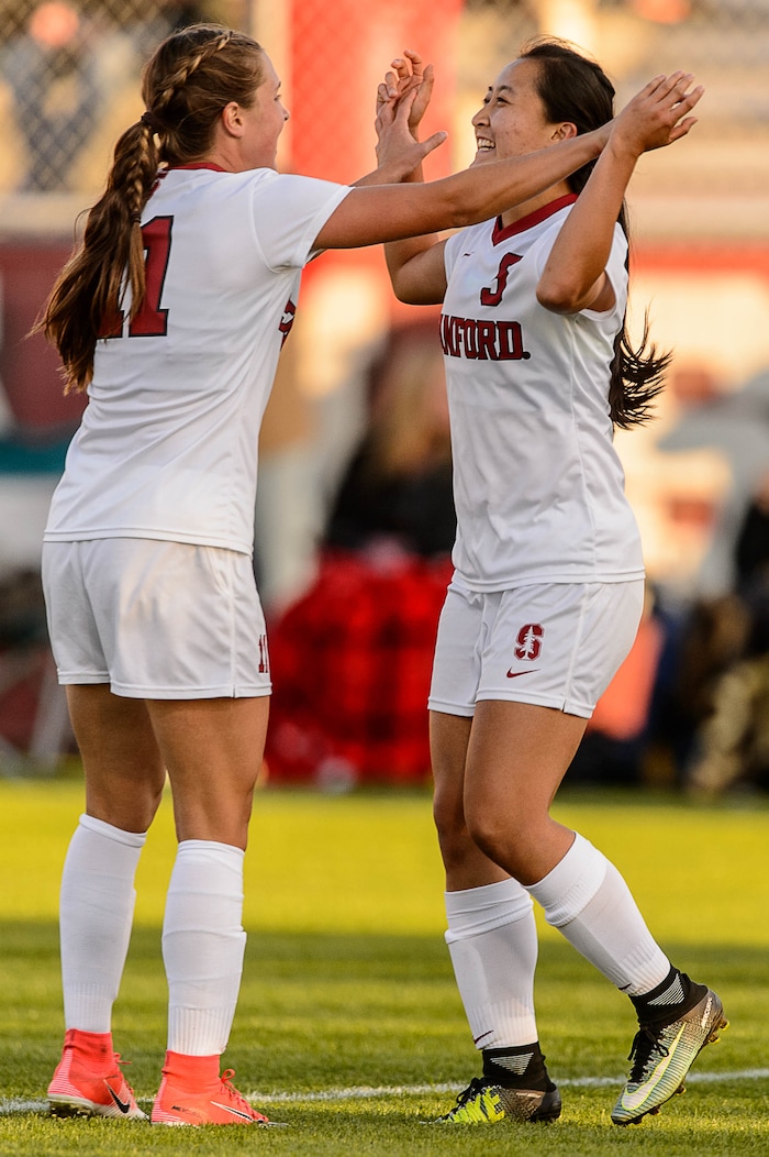 (Trent Nelson | The Salt Lake Tribune) Stanford Michelle Xiao (5) celebrates a goal with teammate Stanford Jordan DiBiasi (11) as the University of Utah hosts Stanford, NCAA Women's Soccer in Salt Lake City Thursday October 5, 2017.