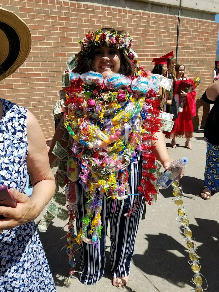 (Courtesy of Claustina Mahon-Reynolds) High school students in Salt Lake City School District wear bundles of leis after graduation this year. The flower necklaces were banned from the floor during the ceremonies at the Huntsman Center. Pacific Islander students, when allowed, typically wear one or two fresh leis during their graduation to honor their heritage. Relatives then pile more on after the ceremony, in celebration.
