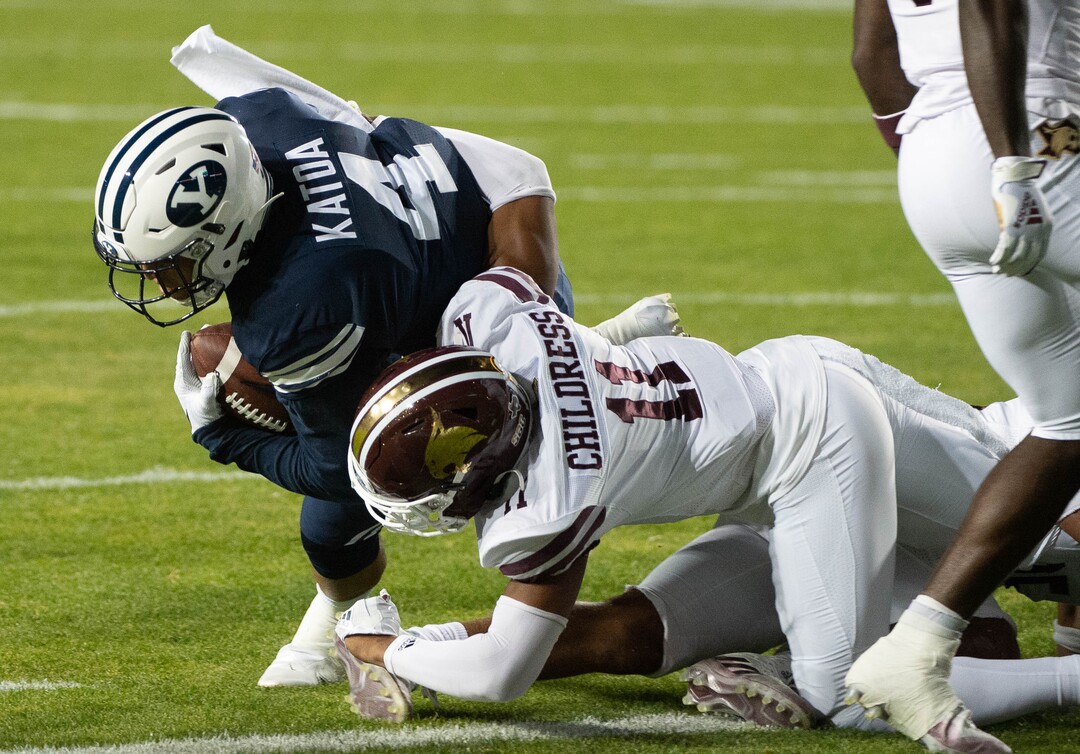 (Francisco Kjolseth  |  The Salt Lake Tribune) Brigham Young Cougars running back Lopini Katoa (4) pushes past Texas State Bobcats safety Zion Childress (11) for the Cougar’s first touchdown against Texas State during an NCAA college football game at LavVell Edwards Stadium, Saturday, oct. 24, 2020, in Provo, Utah.