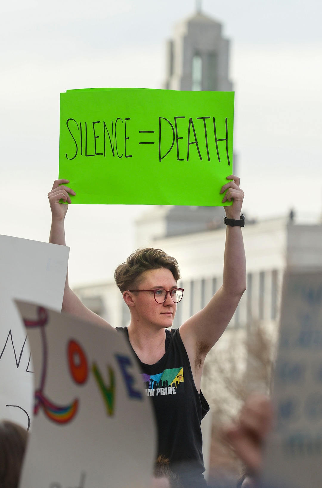 (Leah Hogsten  |  The Salt Lake Tribune)  Brynn Adams, who is gender non-binary, rallies with hundreds of other students and supporters Friday. Brigham Young University LGBTQ students took their concerns about the schoolÕs policy reversal regarding romantic behavior by same-sex couples to The Church of Jesus Christ of Latter-day Saints office building, Mar. 6, 2020. Despite removing the section on Òhomosexual behaviorÓ from BYU Honor Code last month, The LDS Church has clarified for the first time that same-sex romantic behavior is still Ònot compatibleÓ with the rules at BYU.