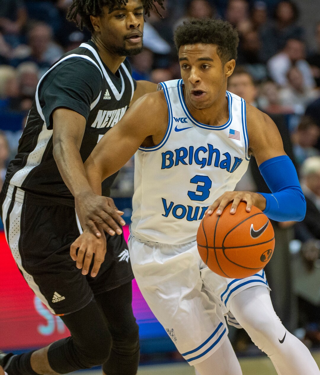 (Rick Egan  |  The Salt Lake Tribune)        Brigham Young Cougars guard Blaze Nield (3) dribbles past Nevada Wolf Pack guard Lindsey Drew (14), in basketball action between the Brigham Young Cougars and the Nevada Wolf Pack, at the Marriott Center, in Provo, Saturday, December 10, 2019.