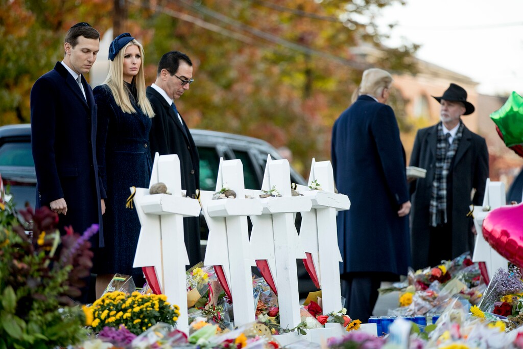 (Andrew Harnik | The Associated Press) From left, President Donald Trump's White House senior adviser Jared Kushner, Ivanka Trump, the daughter of President Donald Trump, Treasury Secretary Steven Mnuchin, President Donald Trump, and Tree of Life Rabbi Jeffrey Myers, right, visits a memorial for those killed at the Pittsburgh's Tree of Life Synagogue in Pittsburgh, Tuesday, Oct. 30, 2018.