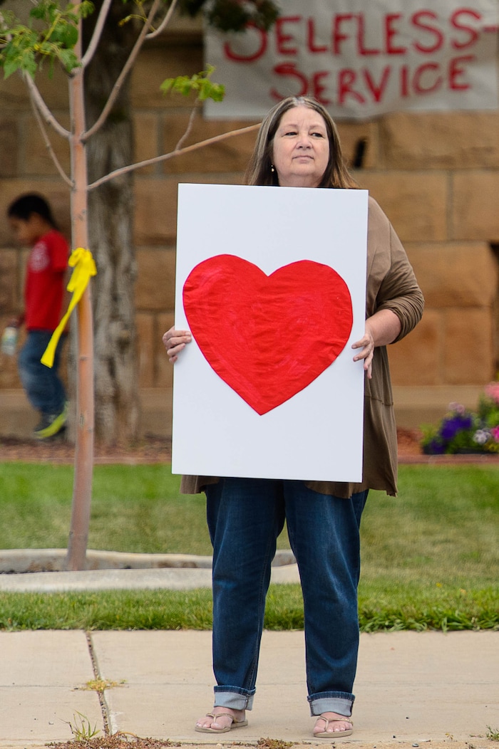 (Trent Nelson | The Salt Lake Tribune)  Crowds lined Main Street in Monticello to honor the motorcade of fallen soldier Aaron Butler, who was killed last week in Afghanistan, , Thursday August 24, 2017.