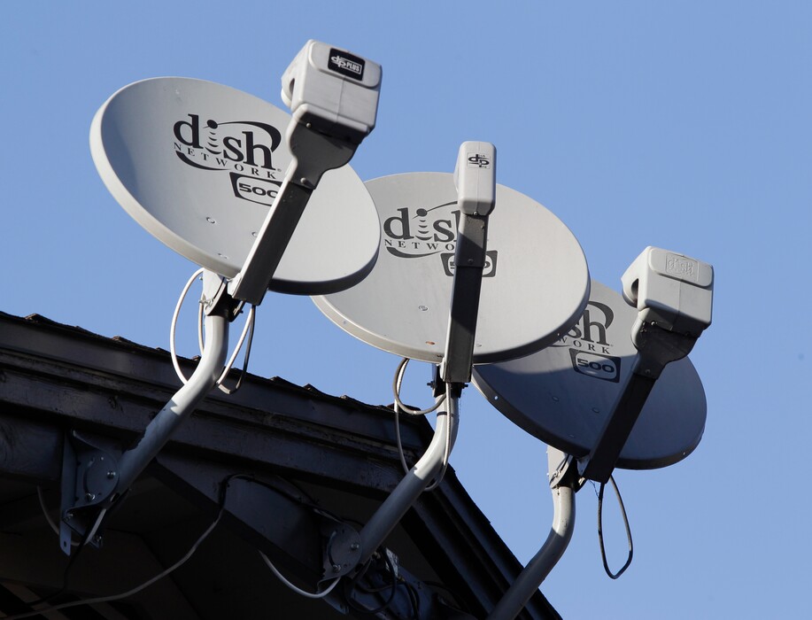 (Paul Sakuma | AP file photo)  Dish Network satellite dishes are shown at an apartment complex in Palo Alto, Calif., in 2011.