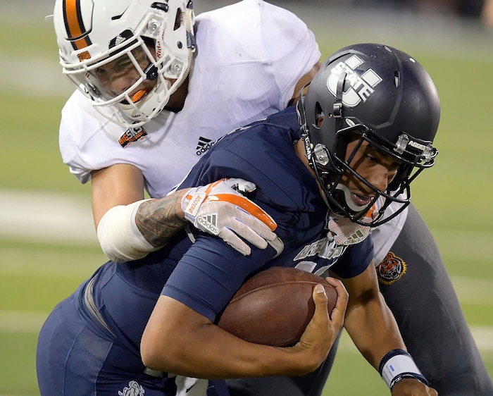 Idaho State defensive back Atoa Fox tackles Utah State quarterback Jordan Love during an NCAA college football game Thursday, Sept. 7, 2017, in Logan, Utah. (Eli Lucero/Herald Journal via AP)