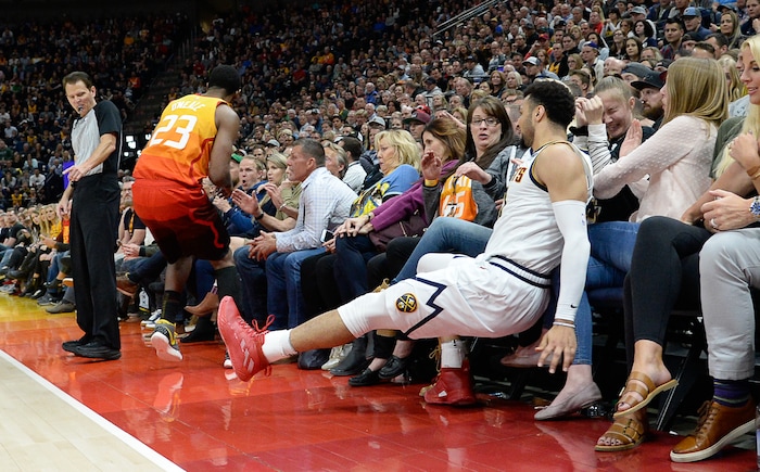 (Francisco Kjolseth  |  The Salt Lake Tribune)  Utah Jazz forward Royce O'Neale (23) chases a ball down with Denver Nuggets guard Jamal Murray (27) ending up in the stands as the Utah Jazz host the Denver Nuggets in their NBA game at Vivint Smart Home Arena Tuesday, April 9, 2019, in Salt Lake City.