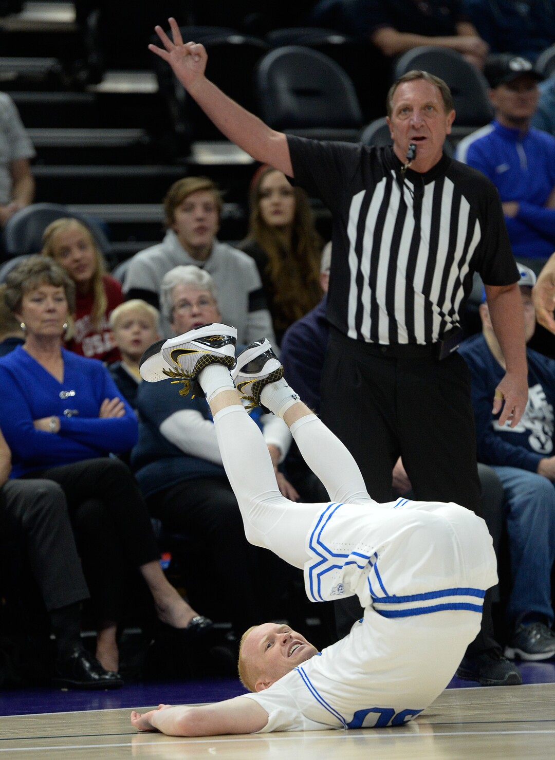 (Francisco Kjolseth  |  The Salt Lake Tribune)  Brigham Young Cougars guard TJ Haws (30) gets upended as BYU takes on UNLV in men's NCAA basketball at Vivint Smart Home Arena in Salt Lake City on Sat. Dec. 7, 2019.