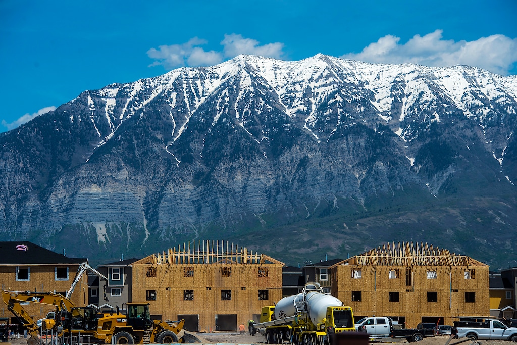 FILE--In this May 23, 2017, file photo, construction continues on new buildings in Vineyard City, Utah. New state population estimates show Utah is continuing to grow, but demographers say it isn't just the state's well-known high birth rate that's driving the increase that made it the country's fastest-growing state last year. (Chris Detrick/The Salt Lake Tribune via AP, file)