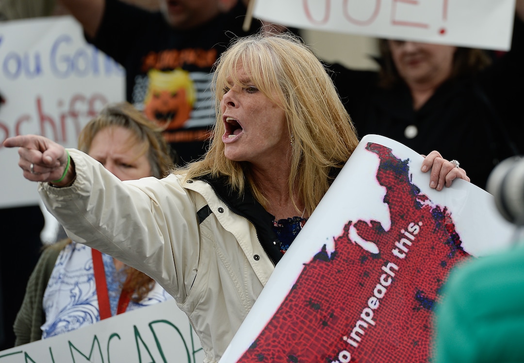 (Francisco Kjolseth | The Salt Lake Tribune)  Carolyn Howard argues with critics of President Trump as two competing rallies spar near Rep. Ben McAdams' office in West Jordan, one seeking to support McAdams and one to criticize him for supporting the impeachment inquiry of Trump on Wednesday, Oct. 9, 2019.