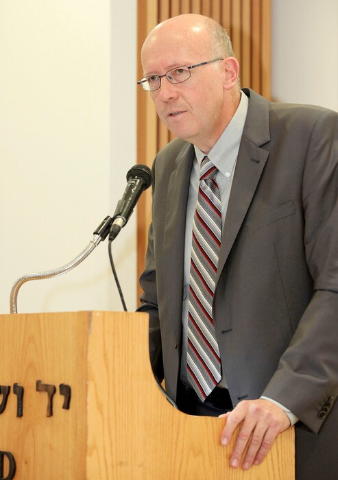 In this picture taken Dec. 8, 2014, and released by Yad Vashem, Holocaust historian Jan Grabowski gives a speech at Yad Vashem, the Israeli Holocaust research center, during a ceremony in which he was awarded for his scholarship, in Jerusalem, Israel. Dozens of international historians have come to the defense of the Holocaust scholar who is being accused of slandering Poland's reputation with research that focuses on the participation of some Poles in the killing of Jews during World War II. The Polish League Against Defamation said last month that Jan Grabowski's scholarship "falsifies the history of Poland." The international historians called the statement against him a "distorted and whitewashed version of the history of Poland during the Holocaust era." (Isaac Harari / Yad Vashem via AP)