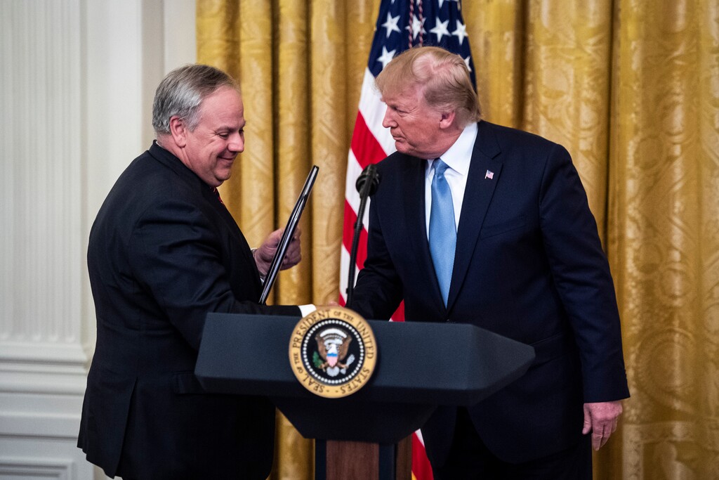(Jabin Botsford | The Washington Post) Interior Secretary David Bernhardt and President Trump in the East Room at the White House on July 8.