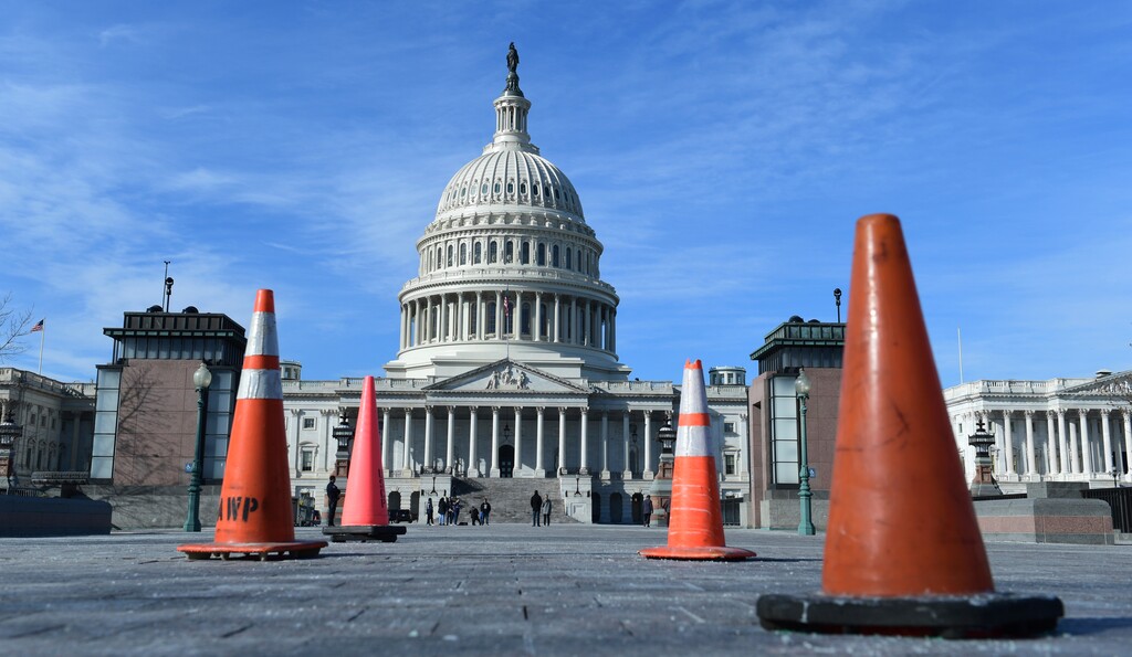 (Susan Walsh | The Associated Press) Construction cones used to cover walkway flaws, stand along the sidewalk on Capitol Hill in Washington, Friday, Jan. 19, 2018. On the edge of a government shutdown, a divided House voted late Thursday to keep the government open past a Friday deadline — setting up an eleventh-hour standoff in the Senate, where Democrats have vowed to kill the measure.