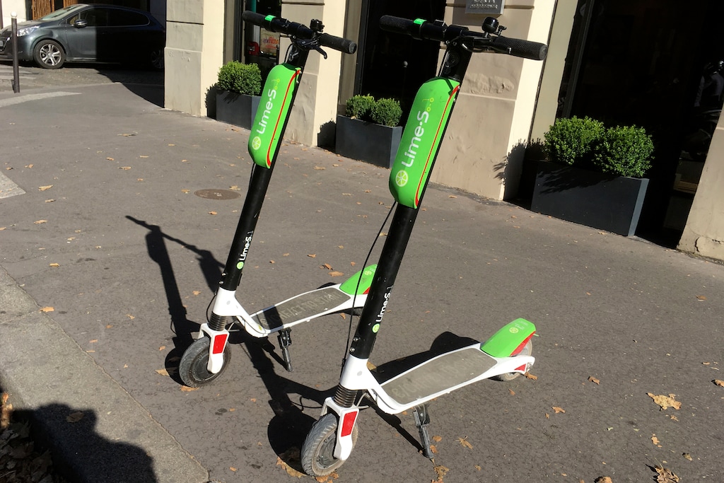 (Michel Euler | Associated Press file photo)  This July 3, 2018, photo shows scooters by Lime in Paris. A Florida woman is suing Lime after a scooter accident left her daughter in a vegetative state.